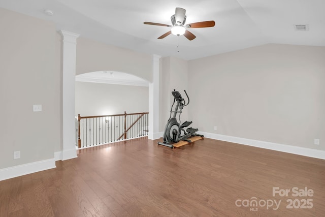12515 Hashanli Pl, Matthews, NC 28105 - exercise area with a ceiling fan, wood finished floors, lofted ceiling, and arched walkways