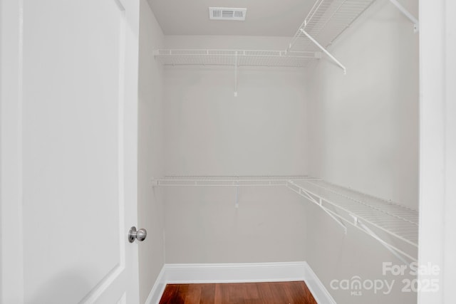 12515 Hashanli Pl, Matthews, NC 28105 - spacious closet featuring dark wood-type flooring
