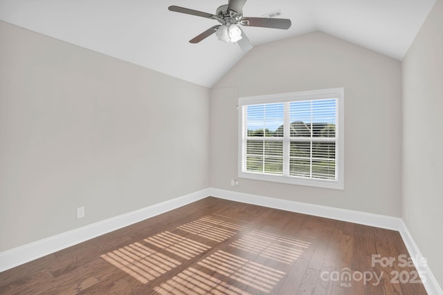 12515 Hashanli Pl, Matthews, NC 28105 - spare room with a ceiling fan, wood finished floors, and vaulted ceiling