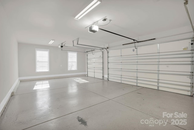 12515 Hashanli Pl, Matthews, NC 28105 - garage featuring a garage door opener and baseboards