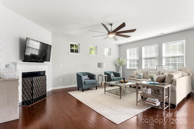 2005 Brightflower Ln, York, SC 29745 - living area with ceiling fan, wood finished floors, and a fireplace with flush hearth