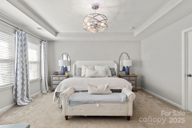 2005 Brightflower Ln, York, SC 29745 - bedroom featuring light colored carpet, a tray ceiling, and a chandelier