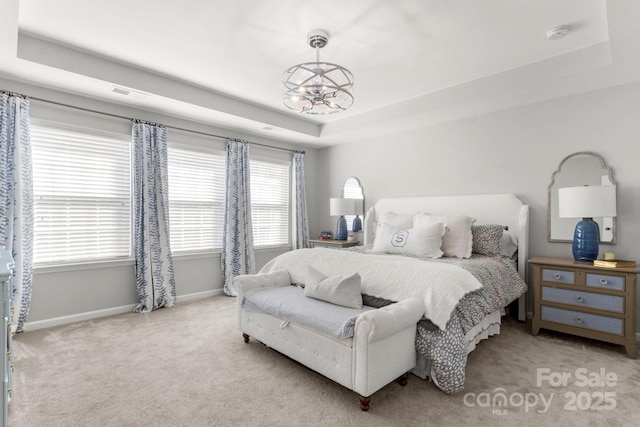 2005 Brightflower Ln, York, SC 29745 - carpeted bedroom featuring a tray ceiling and multiple windows