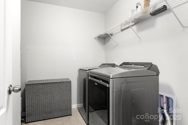 2005 Brightflower Ln, York, SC 29745 - laundry area with washing machine and dryer and light tile patterned flooring