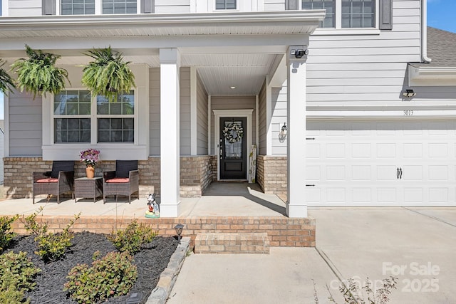 3013 Whipcord Dr, Waxhaw, NC 28173 - view of exterior entry with a porch, driveway, and brick siding