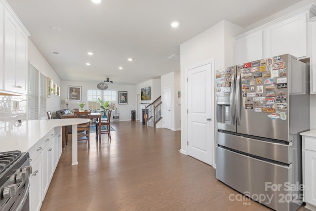 3013 Whipcord Dr, Waxhaw, NC 28173 - kitchen featuring appliances with stainless steel finishes, recessed lighting, light countertops, white cabinetry, and wood finished floors