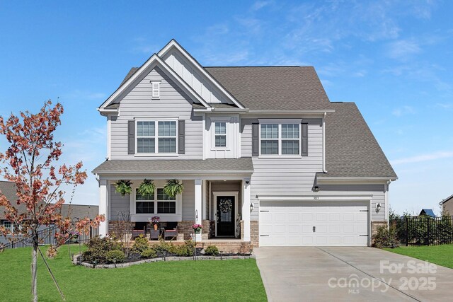 3013 Whipcord Dr, Waxhaw, NC 28173 - craftsman-style house featuring covered porch, concrete driveway, board and batten siding, a garage, and a shingled roof