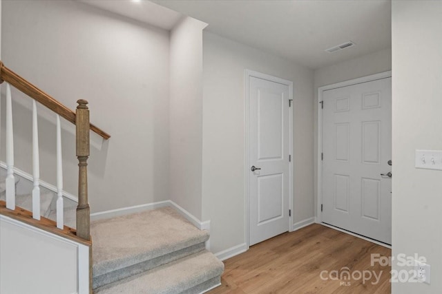 512 Whitehall Cir, Durham, NC 27713 - staircase featuring wood finished floors and baseboards