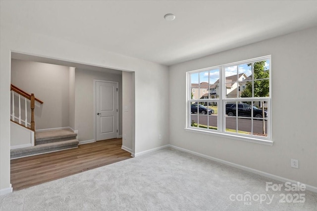 512 Whitehall Cir, Durham, NC 27713 - carpeted empty room with baseboards and stairs