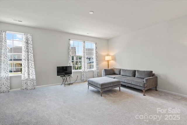 512 Whitehall Cir, Durham, NC 27713 - living area featuring healthy amount of natural light and carpet flooring