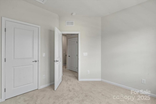 512 Whitehall Cir, Durham, NC 27713 - unfurnished bedroom with light carpet and baseboards