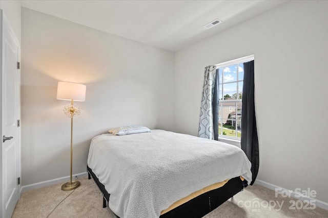 512 Whitehall Cir, Durham, NC 27713 - bedroom with light colored carpet and baseboards