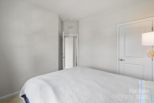 512 Whitehall Cir, Durham, NC 27713 - bedroom with carpet flooring and baseboards