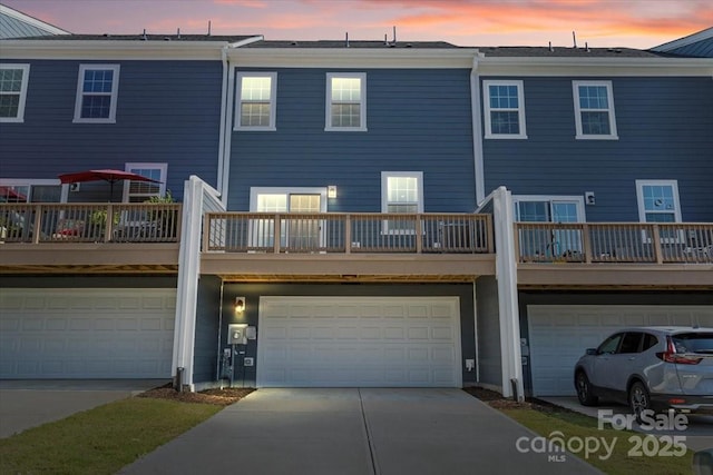 512 Whitehall Cir, Durham, NC 27713 - rear view of property with a garage and concrete driveway