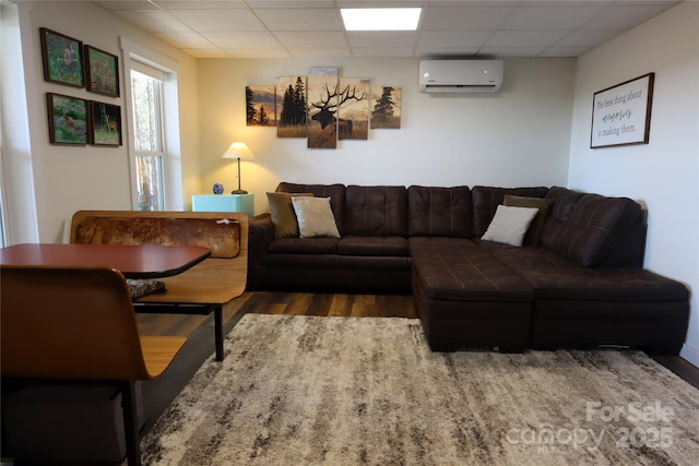 1594 High Valley Way, Lenoir, NC 28645 - living room with an AC wall unit, a drop ceiling, and wood finished floors