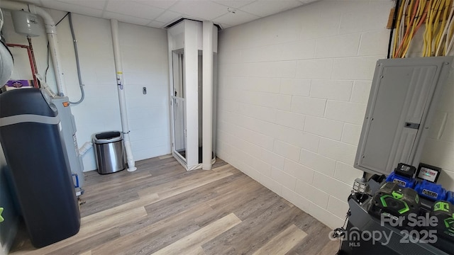 1594 High Valley Way, Lenoir, NC 28645 - below grade area featuring electric panel, concrete block wall, light wood-type flooring, and a drop ceiling