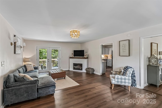 207 Jacksons Run, Morganton, NC 28655 - living area featuring dark wood-style flooring and a glass covered fireplace