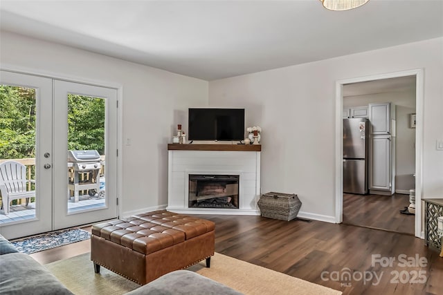 207 Jacksons Run, Morganton, NC 28655 - living area with dark wood-style flooring, french doors, and a glass covered fireplace
