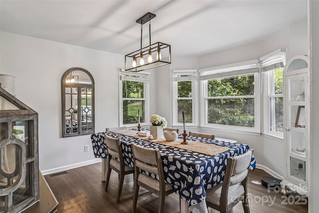 207 Jacksons Run, Morganton, NC 28655 - dining room with dark wood-type flooring and a chandelier