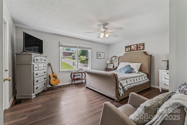 207 Jacksons Run, Morganton, NC 28655 - bedroom featuring dark wood finished floors, a textured ceiling, and a ceiling fan