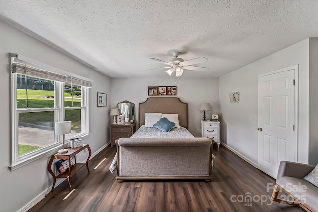 207 Jacksons Run, Morganton, NC 28655 - bedroom featuring a textured ceiling, dark wood-style floors, and ceiling fan