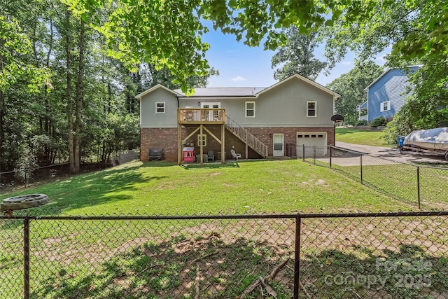 207 Jacksons Run, Morganton, NC 28655 - back of house featuring a garage, asphalt driveway, stairs, and brick siding