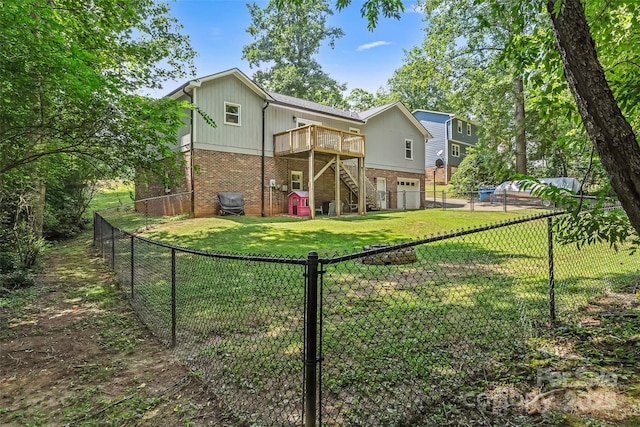 207 Jacksons Run, Morganton, NC 28655 - back of house featuring brick siding, an attached garage, stairway, a deck, and a fenced backyard