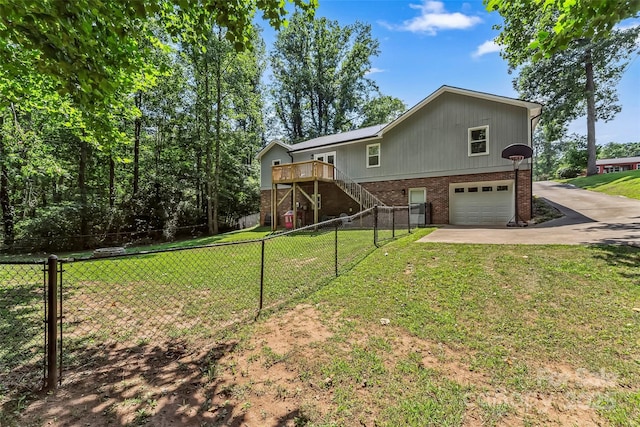 207 Jacksons Run, Morganton, NC 28655 - rear view of property featuring an attached garage, stairs, concrete driveway, brick siding, and a deck