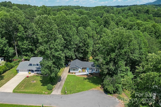 207 Jacksons Run, Morganton, NC 28655 - aerial view of property and surrounding area featuring a heavily wooded area