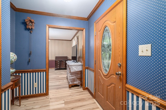 14409 Hackamore Dr, Matthews, NC 28105 - entryway with ornamental molding, wallpapered walls, and wood finished floors