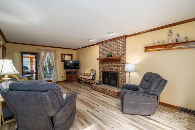 14409 Hackamore Dr, Matthews, NC 28105 - living room with ornamental molding, a fireplace, and light wood finished floors