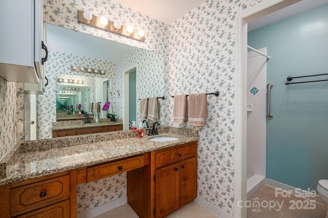 14409 Hackamore Dr, Matthews, NC 28105 - full bath featuring a stall shower, vanity, wallpapered walls, and tile patterned flooring