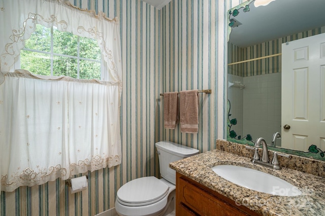 14409 Hackamore Dr, Matthews, NC 28105 - bathroom with wallpapered walls, vanity, and a tile shower