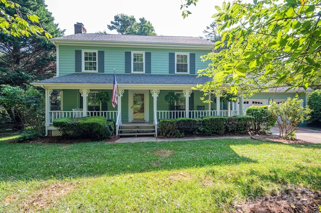 14409 Hackamore Dr, Matthews, NC 28105 - view of front of property with covered porch, a garage, a chimney, and a front lawn