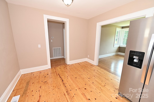 737 8th St SW, Hickory, NC 28602 - spare room featuring light wood finished floors and baseboards