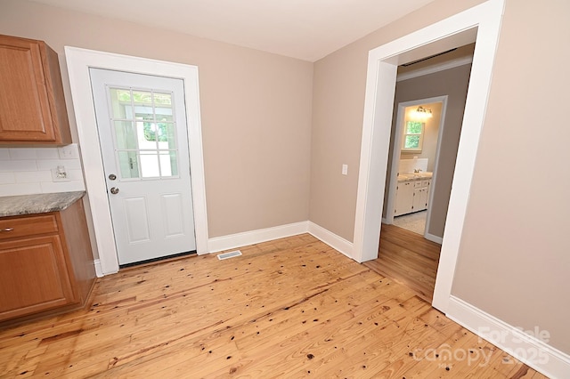 737 8th St SW, Hickory, NC 28602 - doorway featuring light wood-type flooring and baseboards