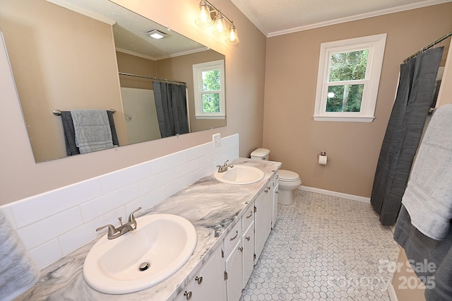 737 8th St SW, Hickory, NC 28602 - bathroom featuring ornamental molding, double vanity, plenty of natural light, and curtained shower