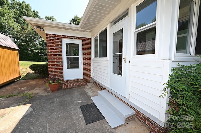 737 8th St SW, Hickory, NC 28602 - view of exterior entry with a patio area and brick siding