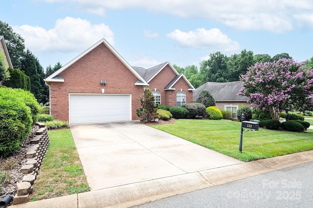 122 Hazeltine Ct, Salisbury, NC 28144 - view of front facade featuring an attached garage, brick siding, driveway, and a front yard