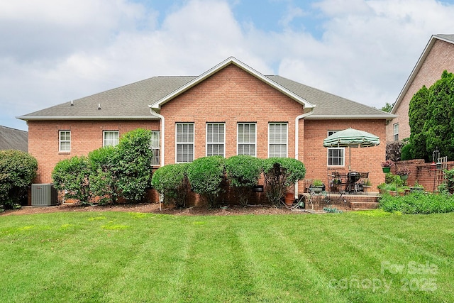 122 Hazeltine Ct, Salisbury, NC 28144 - rear view of property with a yard, brick siding, a patio area, and a shingled roof