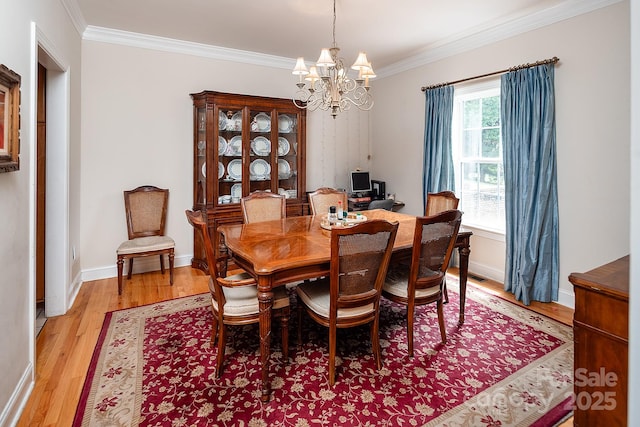122 Hazeltine Ct, Salisbury, NC 28144 - dining space featuring a chandelier, ornamental molding, and light wood-style floors