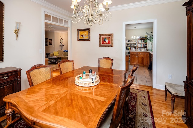 122 Hazeltine Ct, Salisbury, NC 28144 - dining space featuring a chandelier, crown molding, light wood finished floors, and a ceiling fan