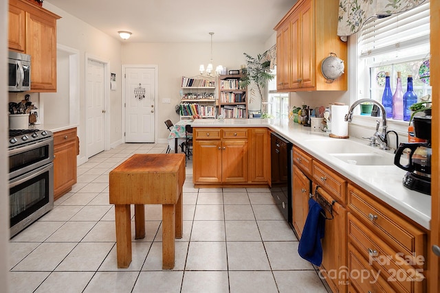 122 Hazeltine Ct, Salisbury, NC 28144 - kitchen with stainless steel appliances, a chandelier, light countertops, light tile patterned flooring, and hanging light fixtures