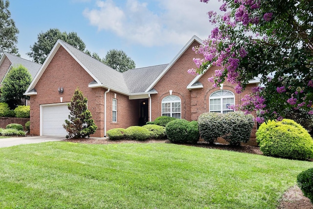 122 Hazeltine Ct, Salisbury, NC 28144 - view of front of house featuring driveway, brick siding, a front yard, and an attached garage