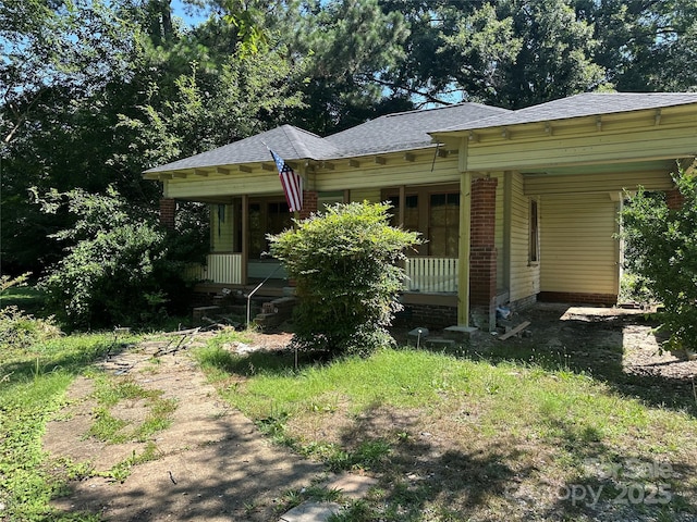 301 Weant St, Salisbury, NC 28144 - view of front of home with a porch, roof with shingles, and an attached carport