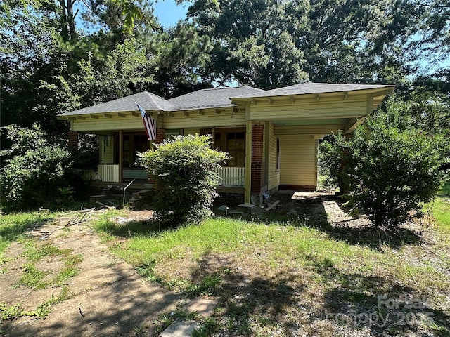 301 Weant St, Salisbury, NC 28144 - bungalow-style home with covered porch, an attached carport, and roof with shingles
