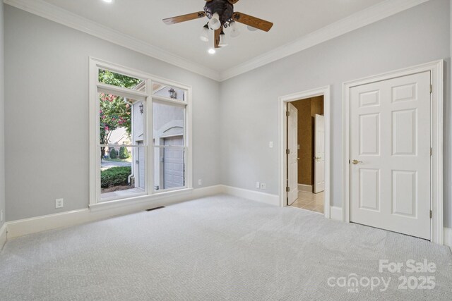 18802 Pentwater Ct, Cornelius, NC 28031 - spare room with carpet, crown molding, a ceiling fan, and recessed lighting