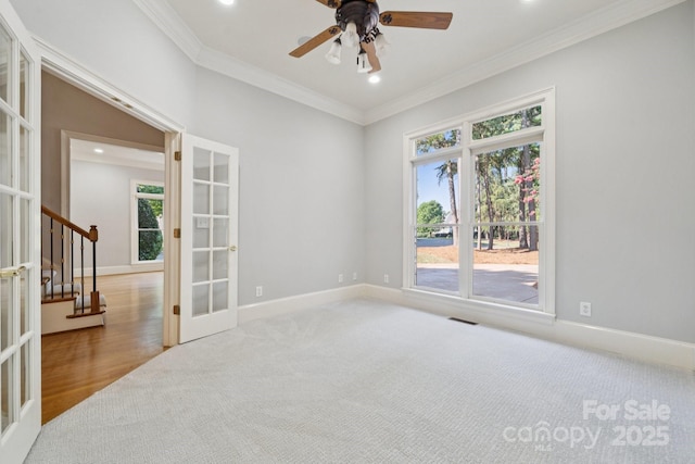 18802 Pentwater Ct, Cornelius, NC 28031 - spare room with french doors, plenty of natural light, crown molding, carpet floors, and stairway