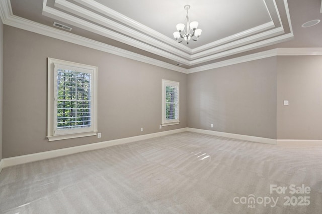 18802 Pentwater Ct, Cornelius, NC 28031 - unfurnished room featuring healthy amount of natural light, a tray ceiling, ornamental molding, and a chandelier