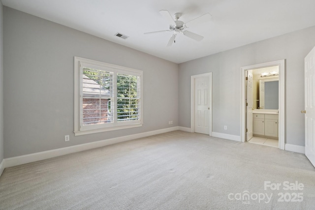 18802 Pentwater Ct, Cornelius, NC 28031 - unfurnished bedroom featuring light colored carpet, ensuite bathroom, and a ceiling fan